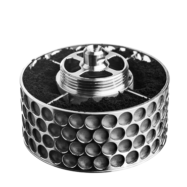 Detailed view of a SpinChem rotating bed reactor featuring a precision-engineered stainless steel cylinder with symmetrical perforations arranged in a honeycomb pattern, containing dark catalyst material. The unit's sophisticated design includes an integral threaded mounting system and built-in filtration, showcasing its advanced capabilities for heterogeneous catalysis.