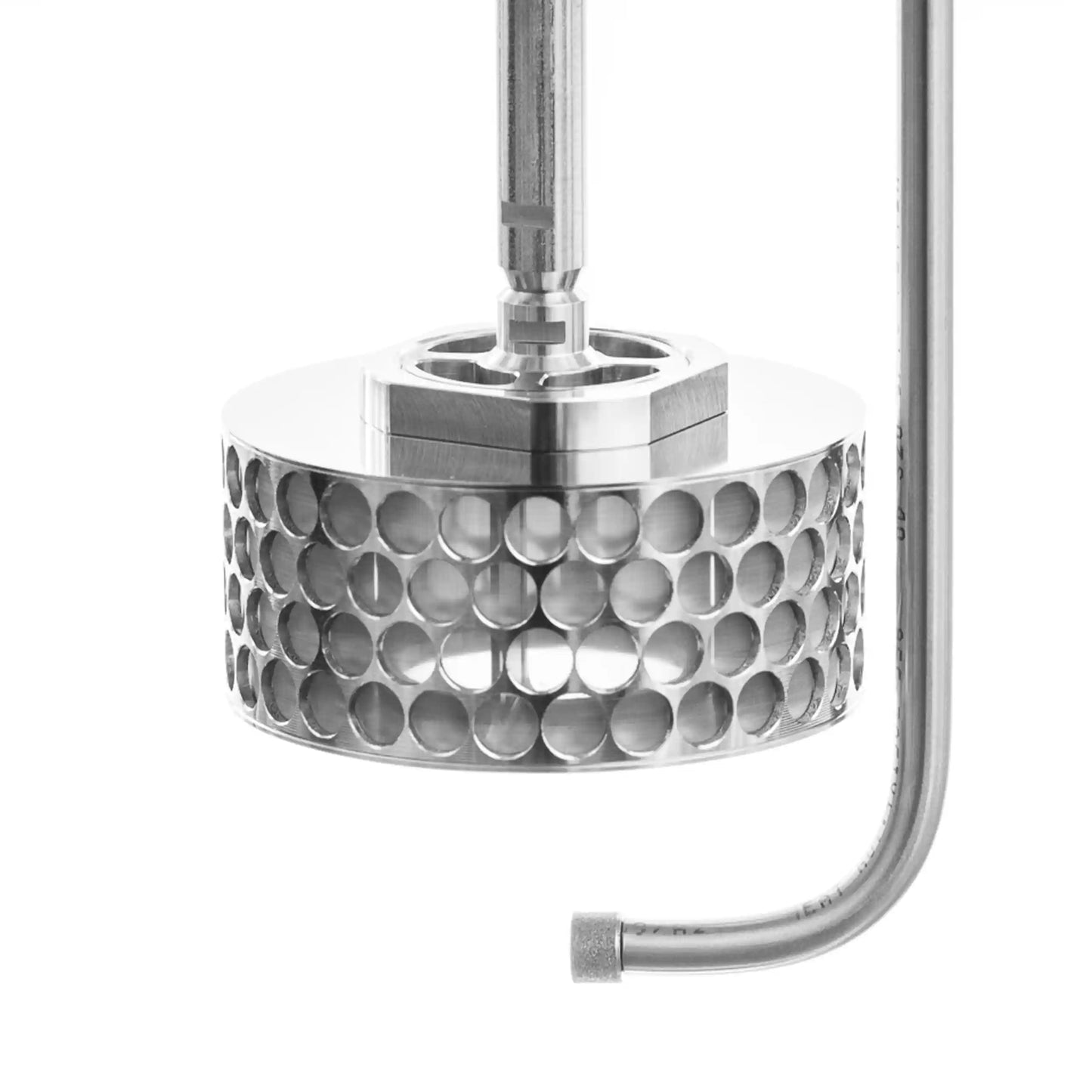 Side view of a stainless steel SpinChem rotating bed reactor featuring a cylindrical design with multiple perforated holes arranged in rows, connected to a vertical shaft and curved inlet pipe, shown against a white background.